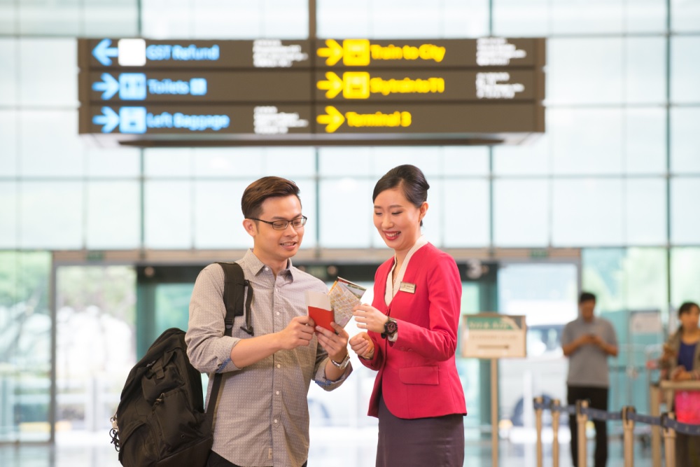 Changi experience agents greeting travellers